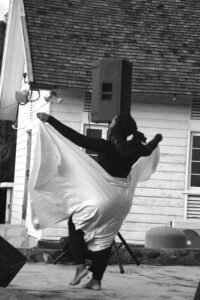 Girl dancing at the Raise the Praise concert at Sculpture Park on the Utech Campus on November 20th, 2025. Girl dancing in black and white